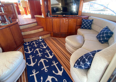 Interior space on yacht with couches and television