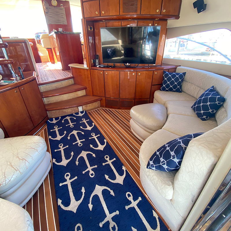 Interior space on yacht with couches and television