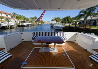 Table and bench on back deck of yacht