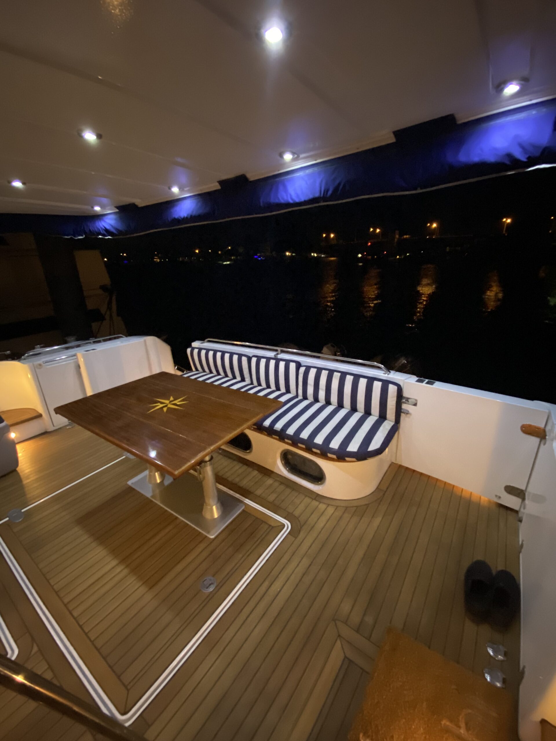 Table and furniture on back of yacht